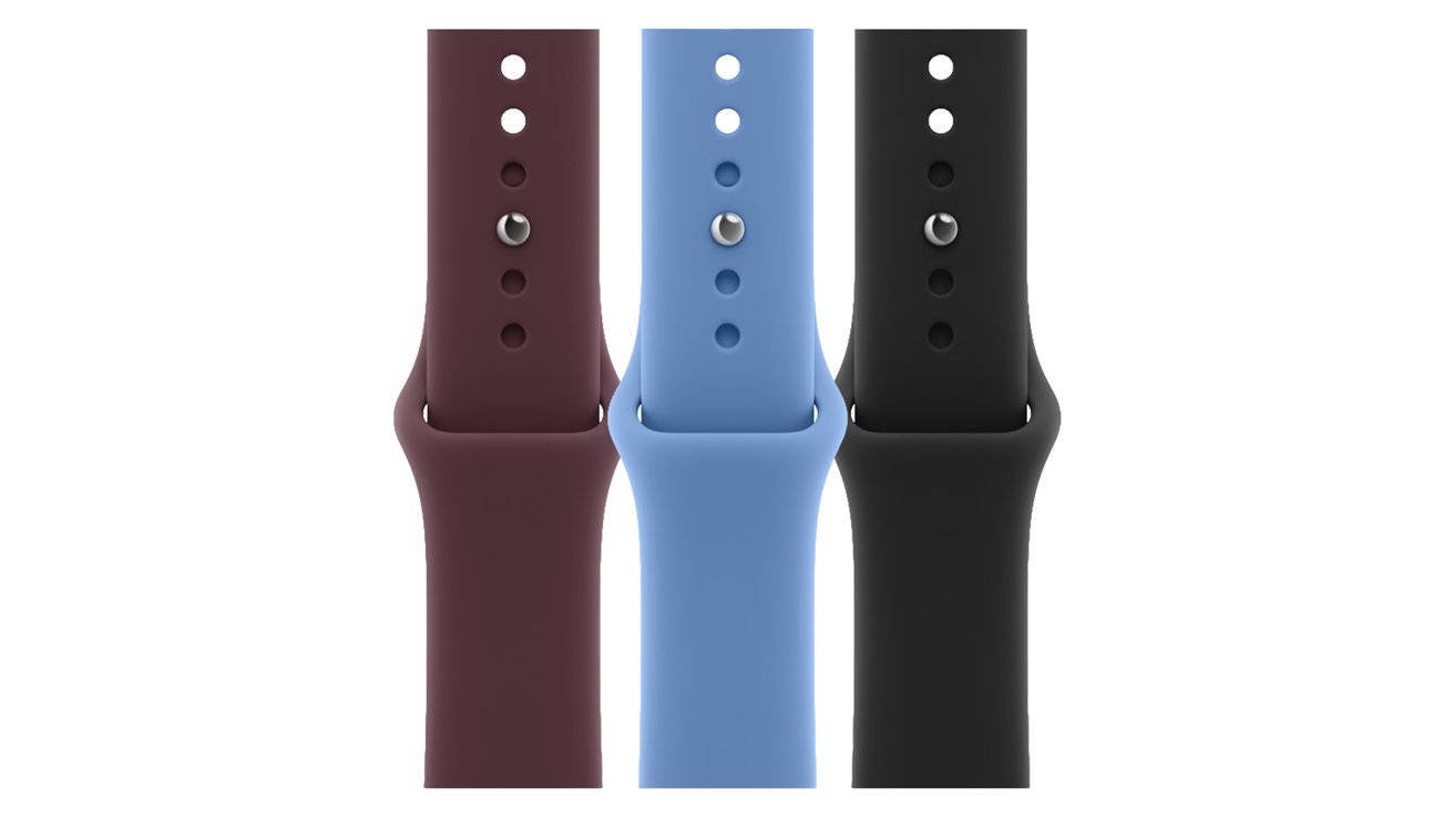 Three silicone smartwatch bands displayed vertically side by side, in dark maroon, light blue, and black colors, each showing adjustment holes and metal fasteners against a white background