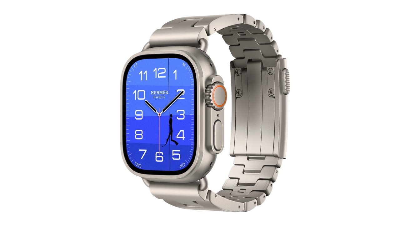 Silver metal smartwatch with rectangular blue watch face displaying white numerals and hands, detailed crown and buttons on the side, attached to a matching silver metal link band