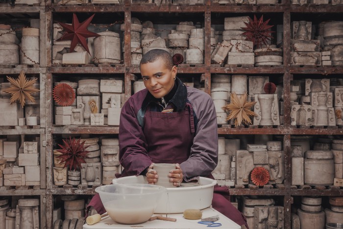 Layton Williams sat down at a potting station, looking ahead.