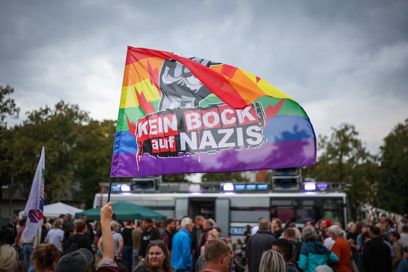 A participant in a counter-demonstration against the far-right AfD waves a flag that reads ‘fed up with Nazis’ in Haldensleben, eastern Germany. Photograph: Ronny Hartmann/AFP via Getty Images