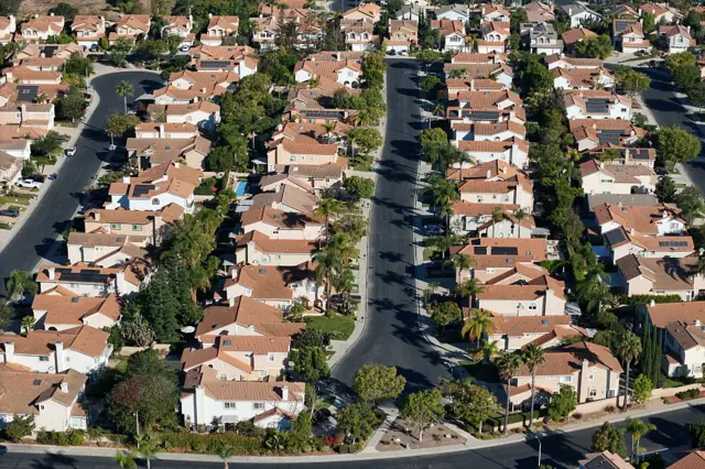 A series of houses are seen in an American suburb