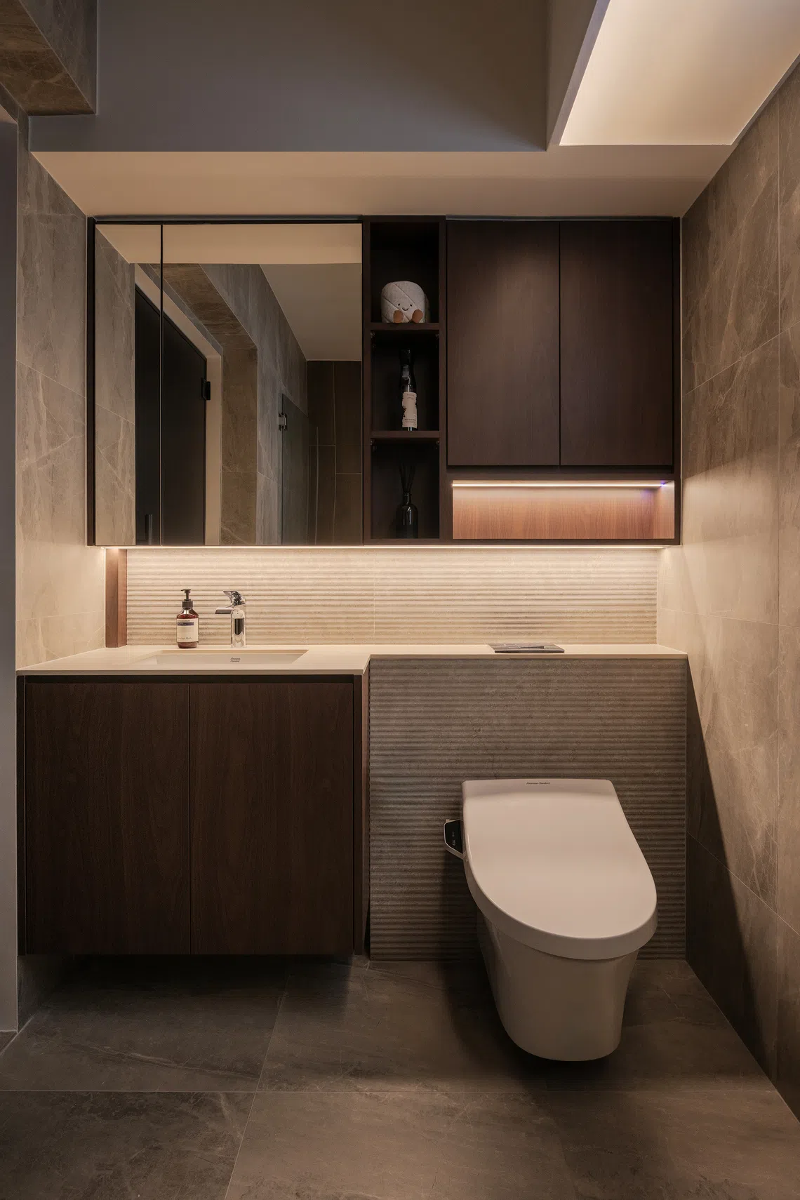 The couple chose a wall-hung water closet for a sleek look and easy maintenance. 