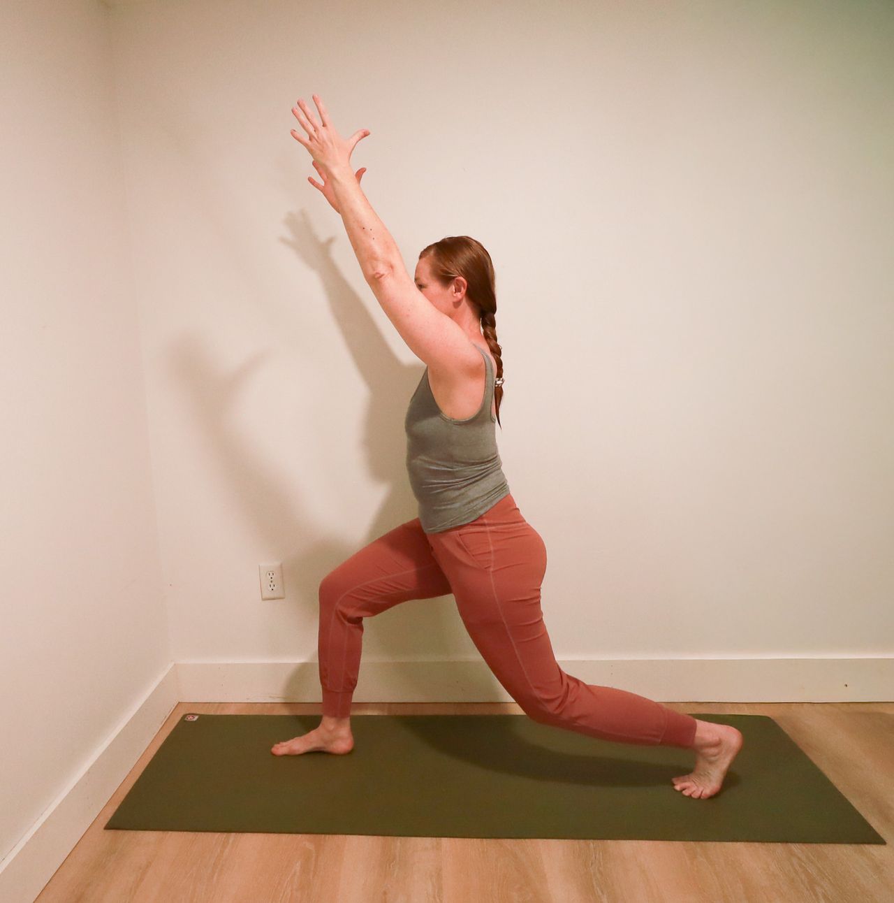 Woman demonstrates yoga pose