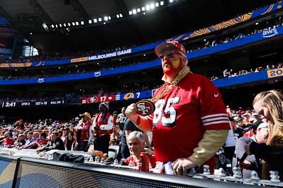 A 49ers fan watches the action at the MCG.
