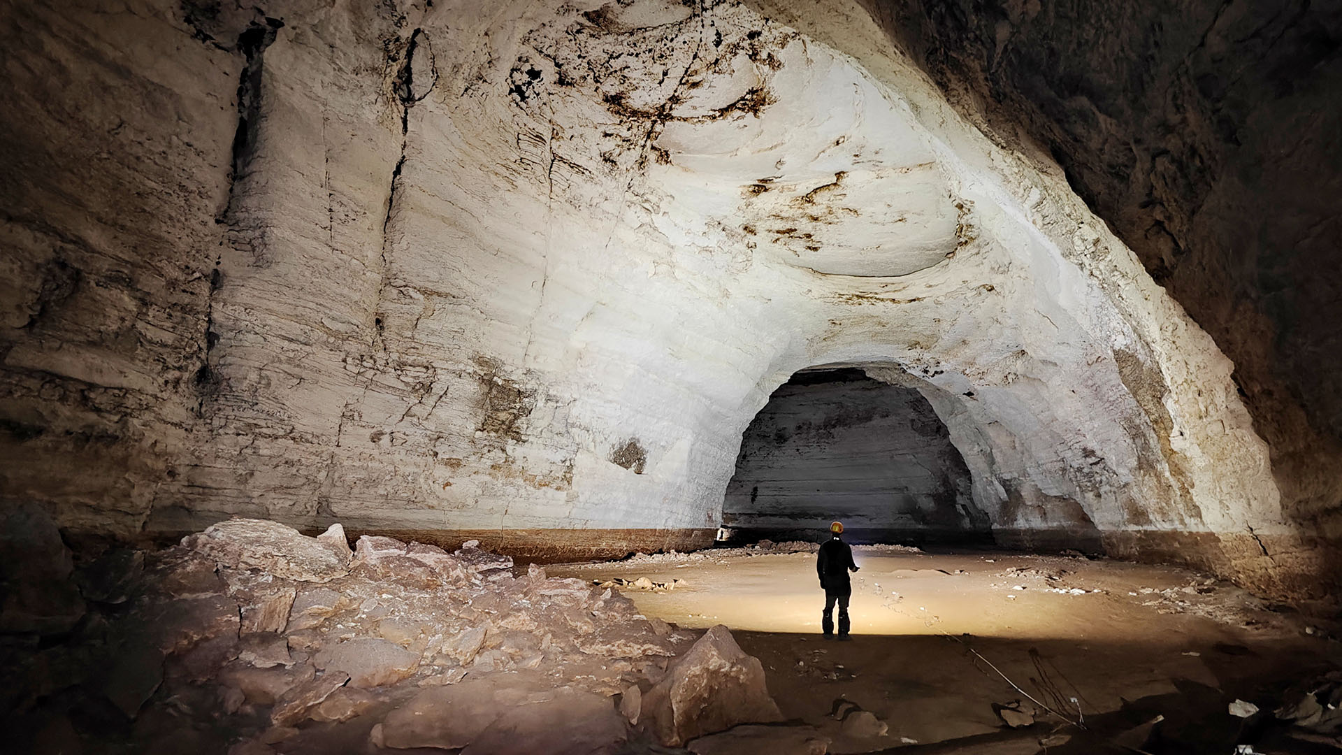 A view of a large white stone cave.
