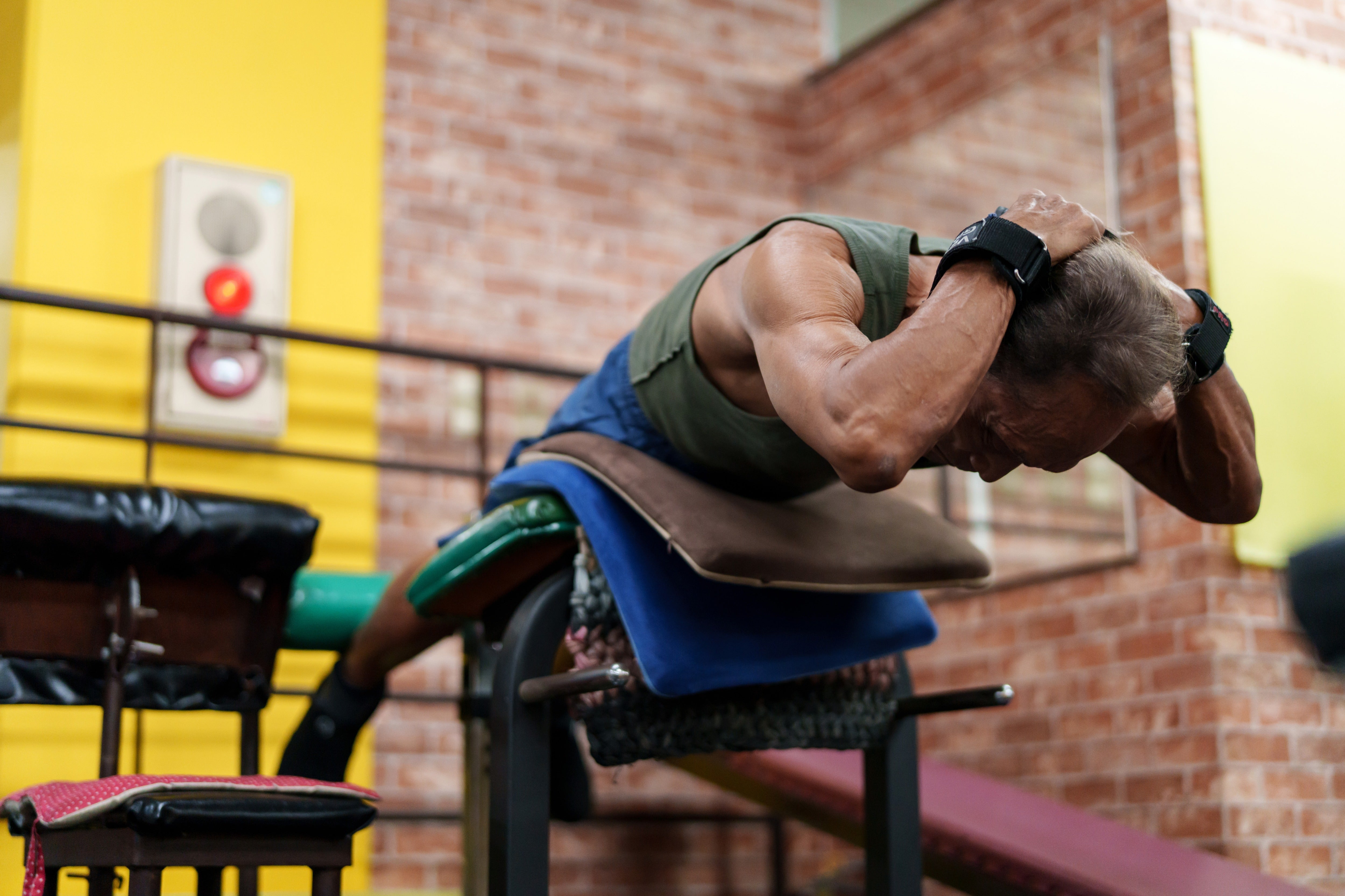 A 90-year-old bodybuilder, trains in his gym in Hiroshima, Japan