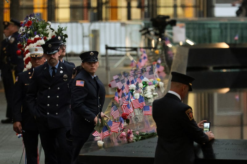 Firefighters gather around the memorial ahead of a ceremony commemorating the 25th anniversary of the September 11th terrorist attacks on the World Trade Center at the National 9/11 Memorial & Museum on September 11th, 2026 in New York. Photograph: Michael M. Santiago/Getty Images.