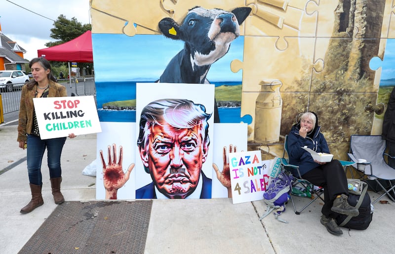 People hold placards as they protest against a visit by US president Donald Trump in Doonbeg. Photograph: Paul Faith/AFP via Getty Images