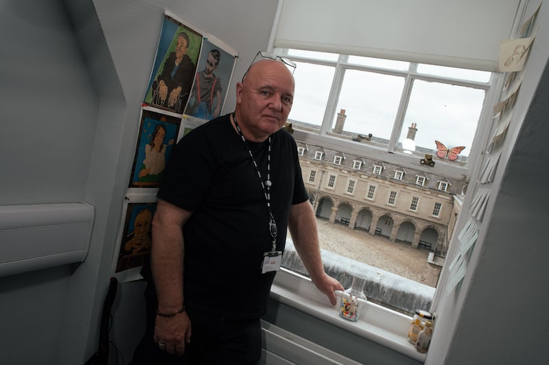 James Doyle in his office at the Irish Museum of Modern Art with some of his own paintings behind him. 'I couldn’t work anywhere else. I really couldn’t.'