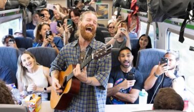 "I can't believe my eyes, it's Jesus Christ Superstar on a train!" Overall winner of Event Photography Awards 2026 bags US$1,350 with shot of singer Sam Ryder on train to Glastonbury Festival