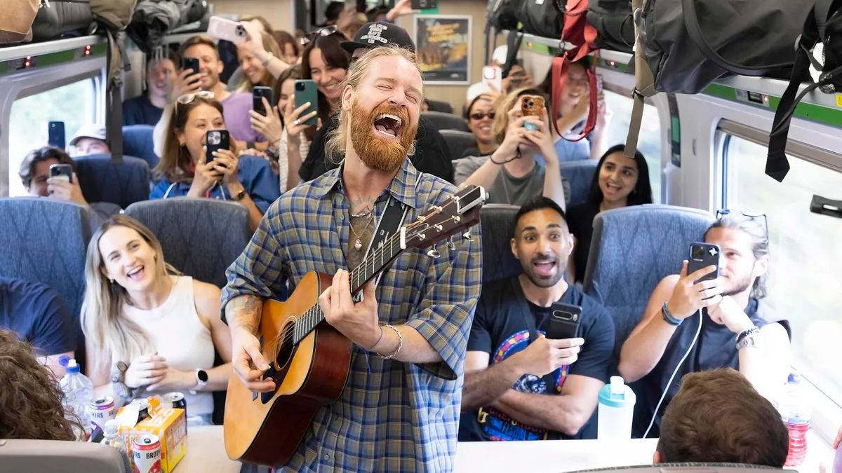 "I can't believe my eyes, it's Jesus Christ Superstar on a train!" Overall winner of Event Photography Awards 2026 bags US$1,350 with shot of singer Sam Ryder on train to Glastonbury Festival