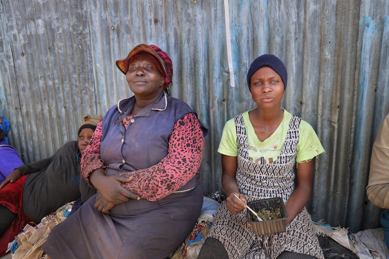 The  ‘queen of the dumpsite’ and Jane Wangechi. Photograph: Hannah McCarthy