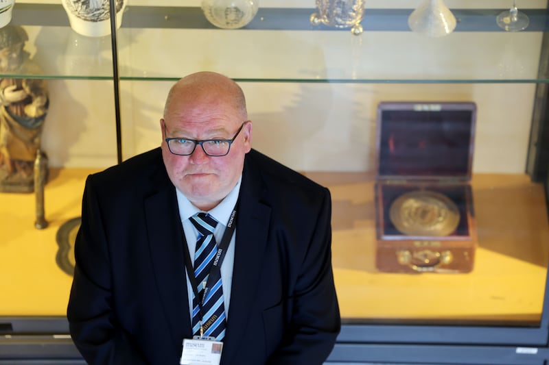 Tom Murphy, visitor services and security officer at the National Museum of Ireland Collins Barracks, in front of the Great Seal of the Irish Free State. Photograph: Alan Betson/The Irish Times

