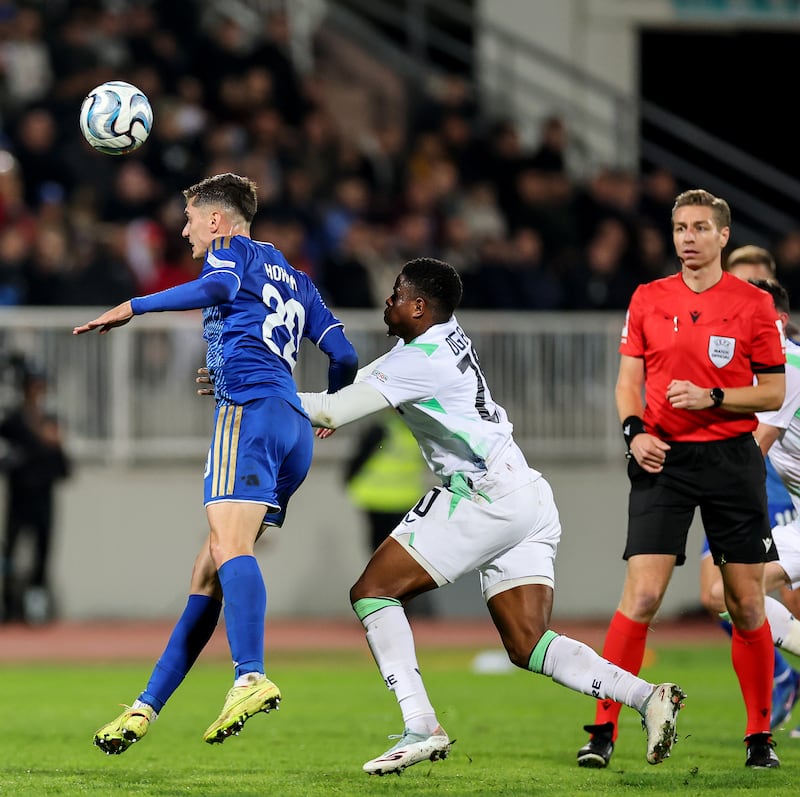 Kosovo's Veldin Hodža with Ireland's Chiedozie Ogbene. Photograph: Ryan Byrne/Inpho