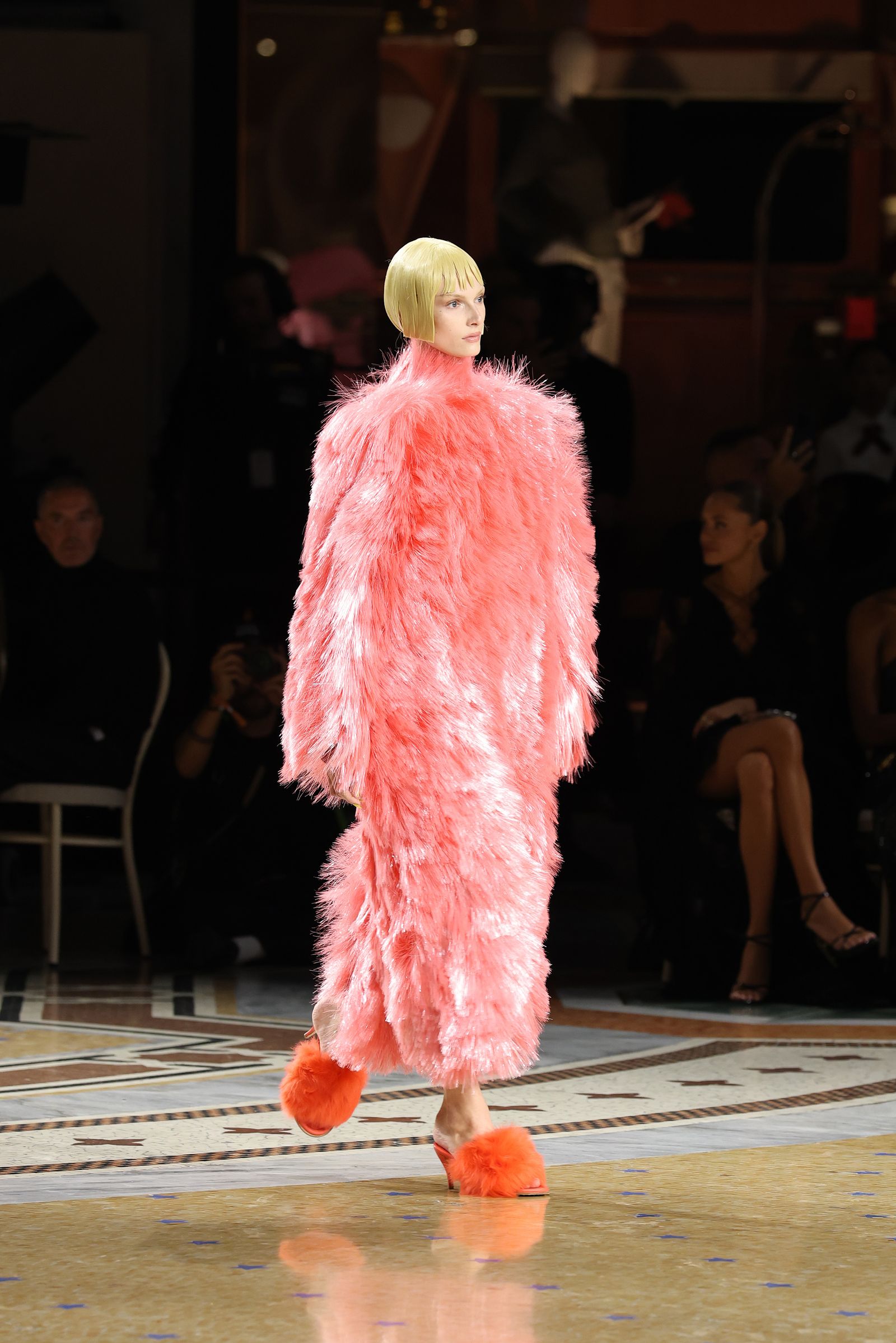Image may contain Polina Kuklina Adult Person Chair Furniture Fashion Performer Solo Performance Clothing and Coat