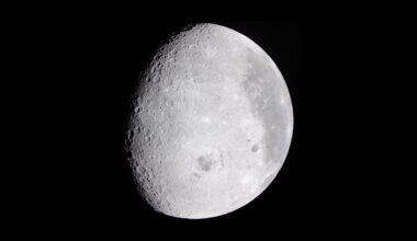 The moon in a black sky.