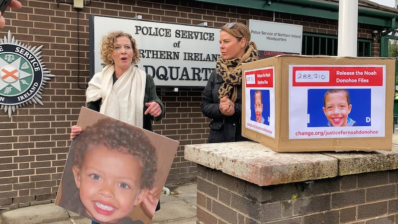 Fiona Donohoe (left) delivering a petition to police headquarters in Belfast in February 2022. Photograph: Rebeca Black/PA