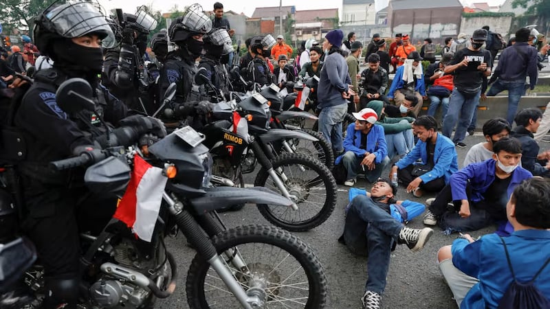 Riot police guard the parliament building in Jakarta, Indonesia, during a protest against rising prices earlier this year. Photograph: Willy Kurniawan/Reuters