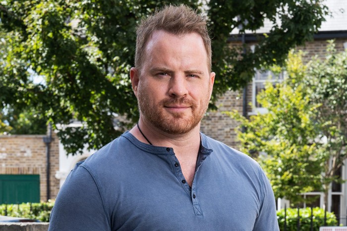 Rob Kazinsky poses as Sean Slater on the set of Walford on a sunny day for EastEnders.