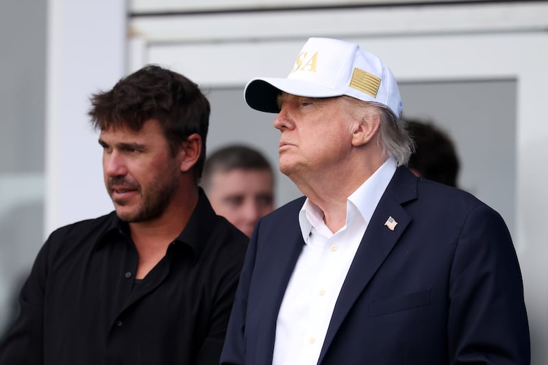 Brooks Koepka of the United States speaks with US president Donald Trump on day three of the Amgen Irish Open in Doonbeg on Saturday. Photograph: Richard Heathcote/Getty Images