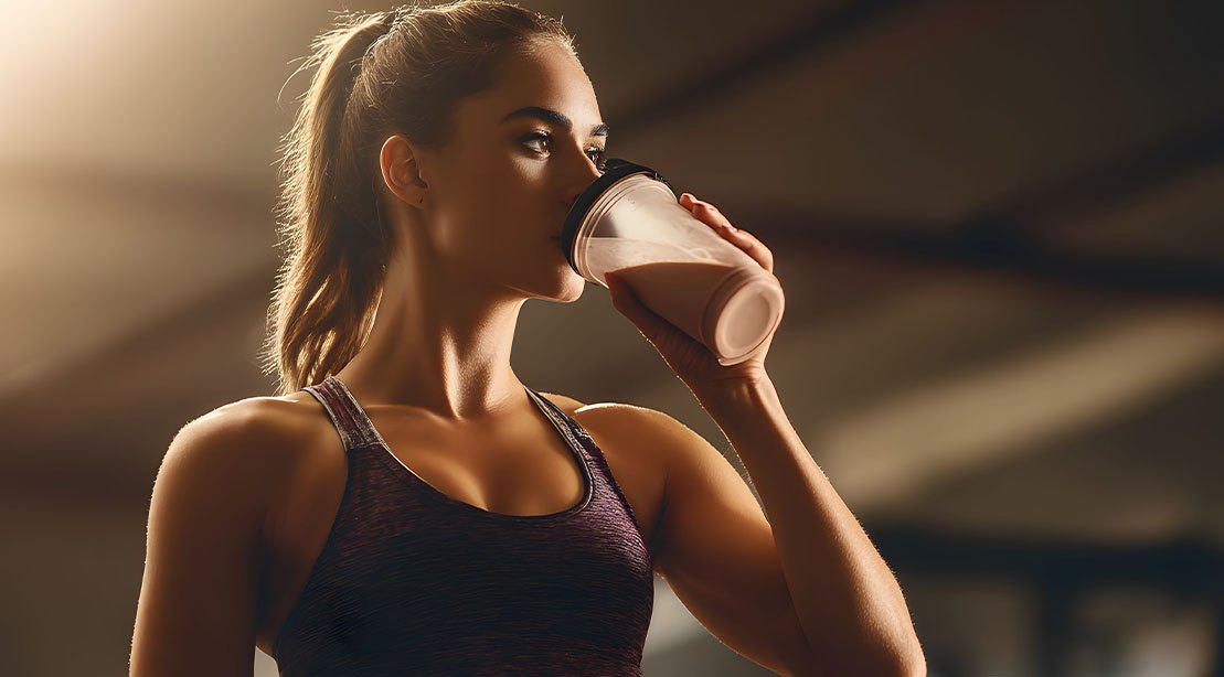 Fit female drinking a protein shake loaded with creatine