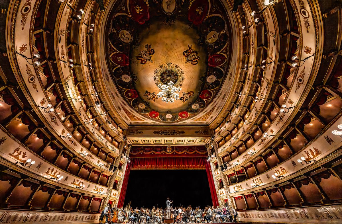 Photo titled Pavorotti’s Place, taken by Stephen Cain. It shows the Municipal Theatre of Modena in Italy. In 2007, the theatre was named after the famous Italian operatic tenor Luciano Pavarotti.
