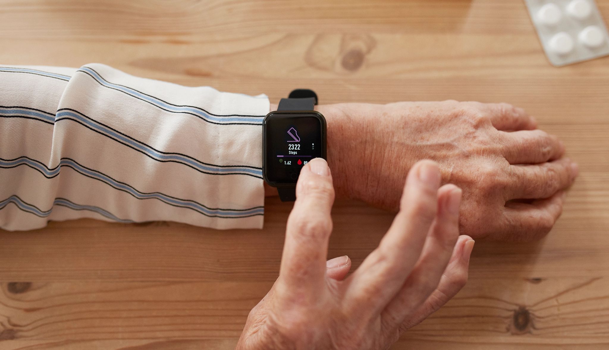 AARP Smart Guide to Wearable Technology steps being counted by a smart watch