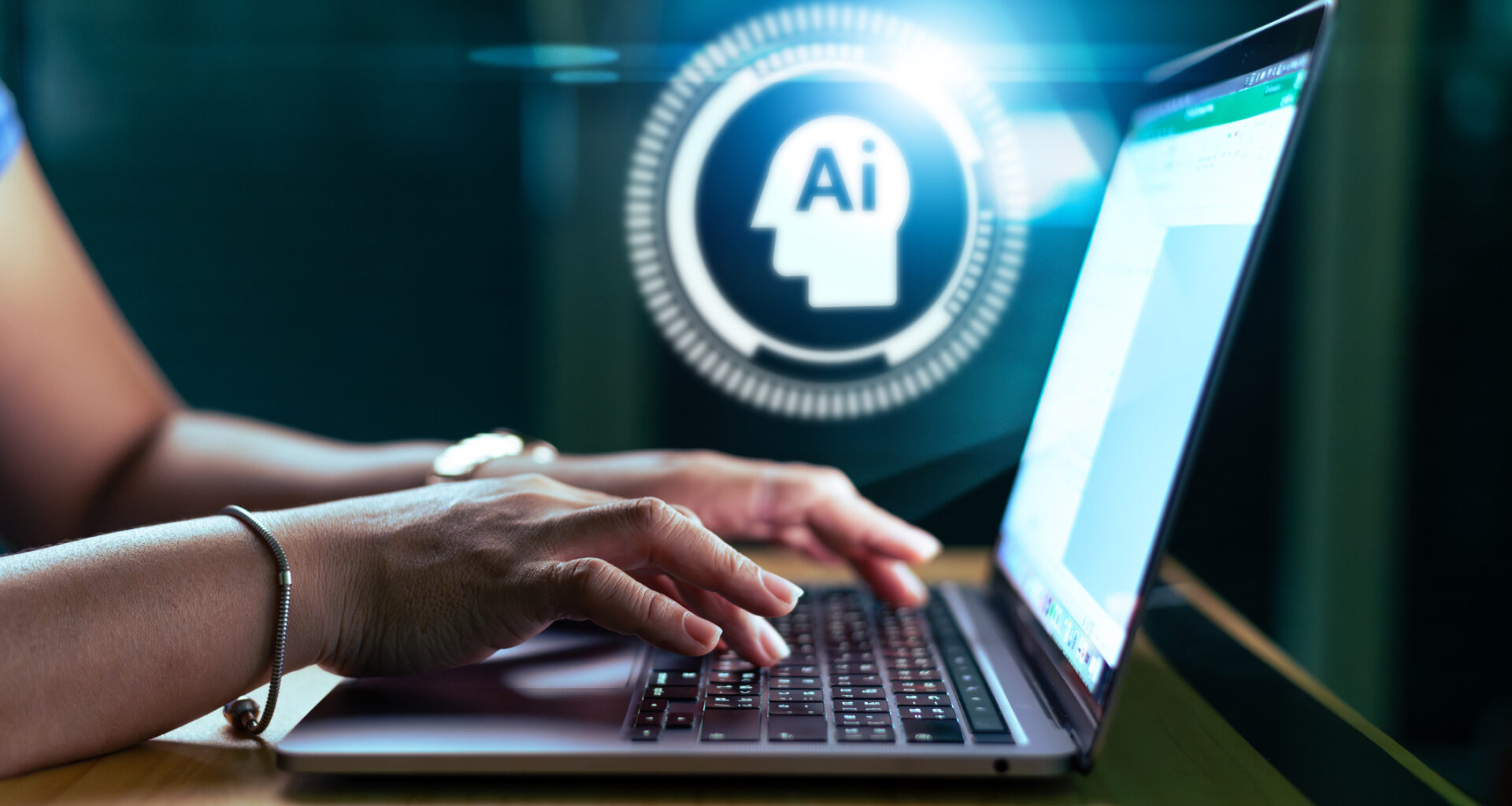AI hologram and the woman using a laptop computer.