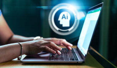 AI hologram and the woman using a laptop computer.