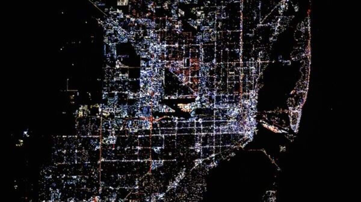 A photograph of Miami lit by multi-colored LEDs in 2025 taken from the International Space Station. A photograph of Miami lit by multi-colored LEDs in 2025 taken from the International Space Station.