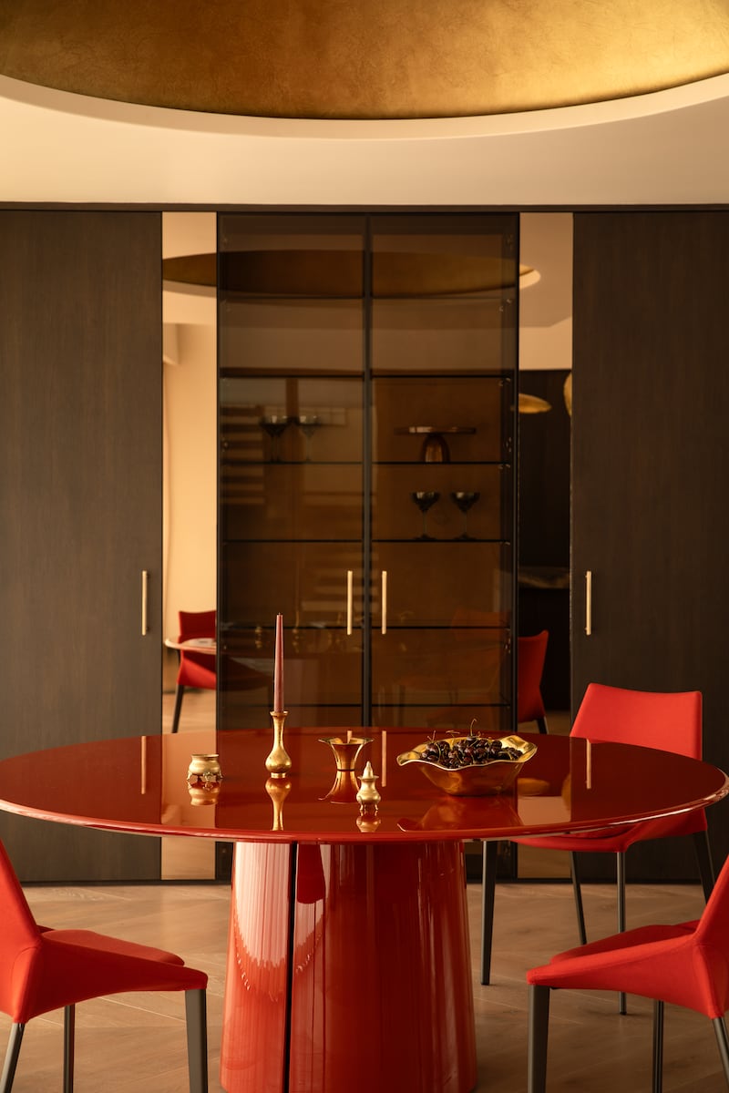 The red table and gold dome overhead