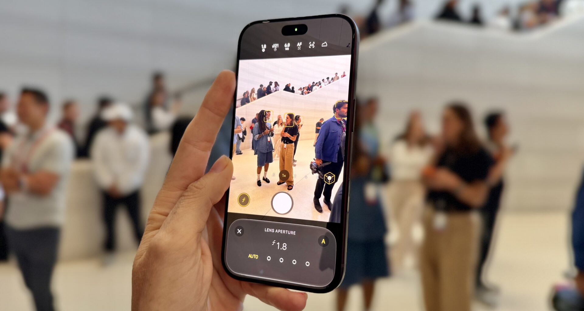 A hand holding an iPhone 18 Pro