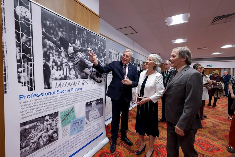 Packie Bonner, President Catherine Connolly and Brian McEnery at Mitchell Library, Glasgow on Friday. Photograph: Maxwells