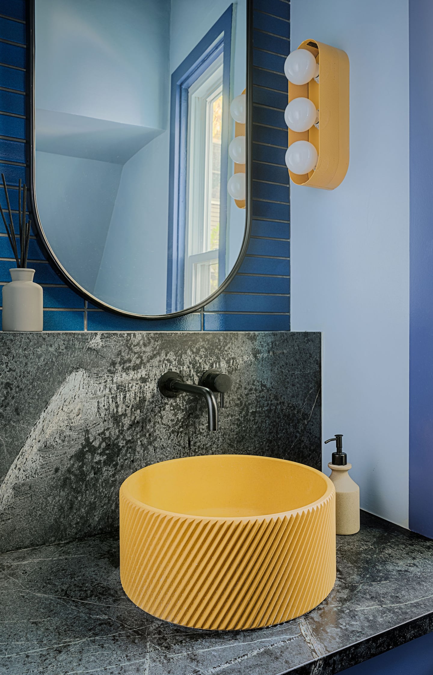 Cambridge’s Nick Andersen and Luke Massa new powder room features a concrete sink from Kask.