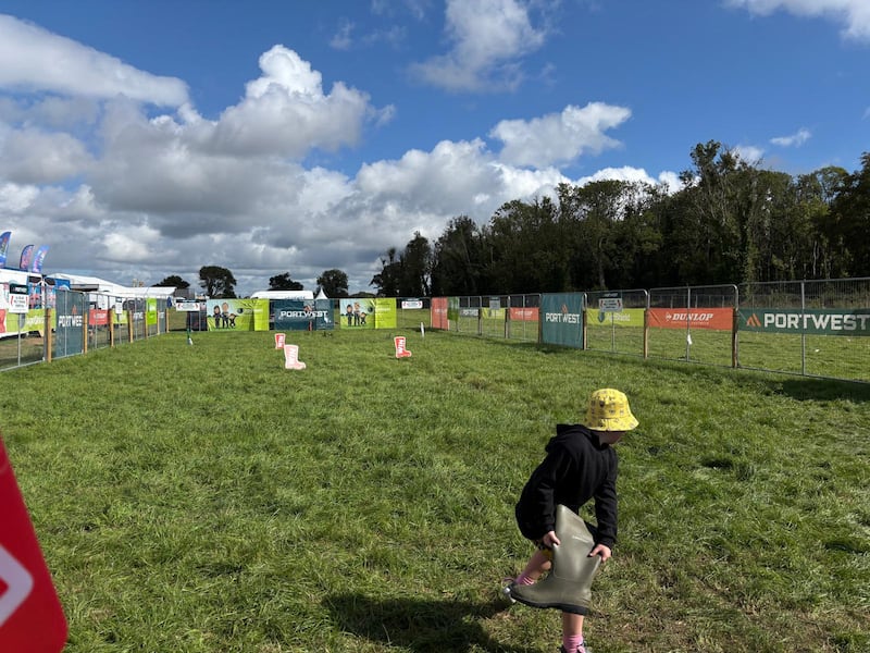 Mikey Cully (7) while competing in the welly throwing competition. Photo: Stephen Conneely/The Irish Times