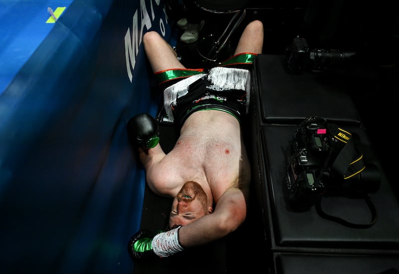 Thomas Carty puts his hands on his head after falling out of the ring in his co-main event against Dave Allen at Croke Park. Photograph: Charles McQuillan/Getty Images