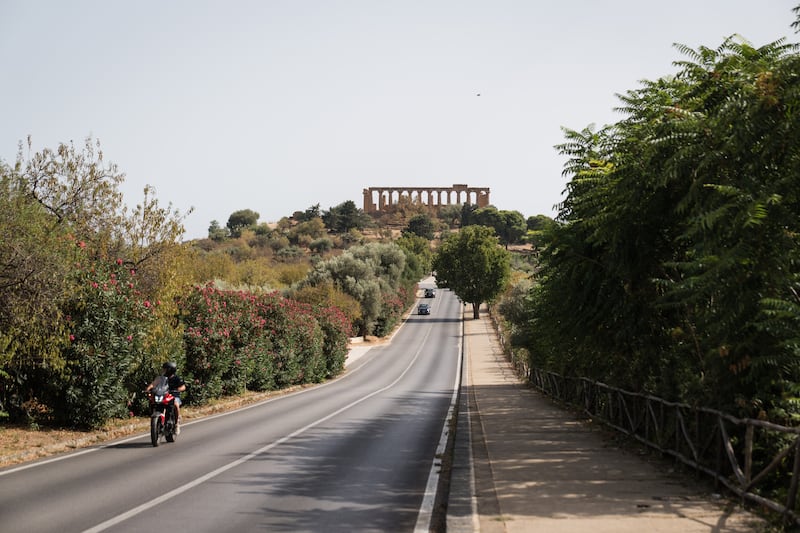 The road leading to the Temple of Juno, also called the Temple of Hera, an ancient Greek ruin in Agrigento, Italy. Photograph: Gianni Cipriano/The New York Times
                      