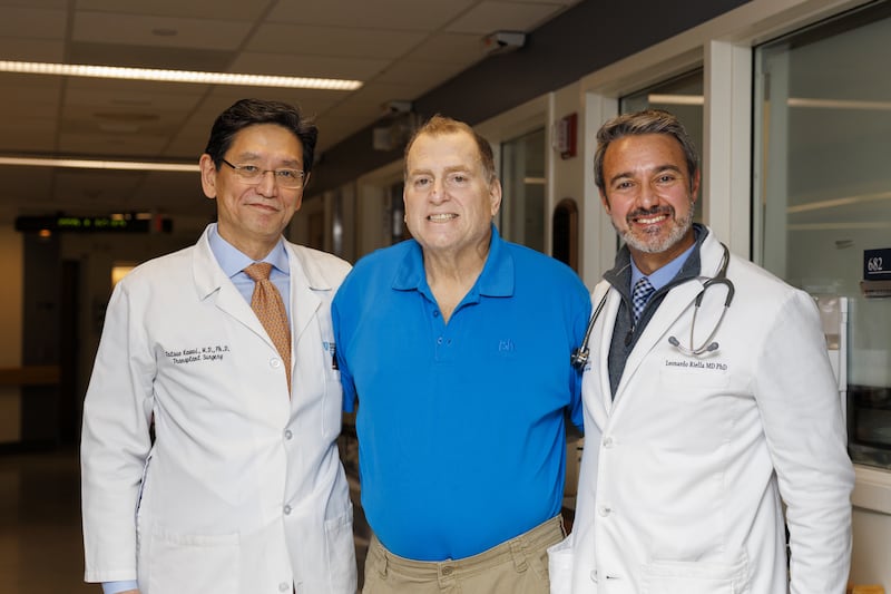 Mr Andrews with his surgeons Dr Tatsuo Kawai, left, and Dr Leonardo Riella