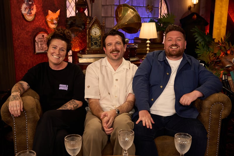 Presenter Kevin McGahern with guests Kyla Cobbler and Crossy on The Traitors Ireland Uncloaked Season 2