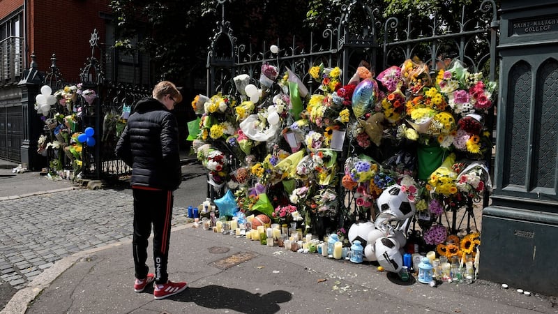 Flowers and tributes for Noah Donohoe outside the gates of his school, St Malachy’s College on Belfast’s Antrim Road, after his death. Photograph: Photopress