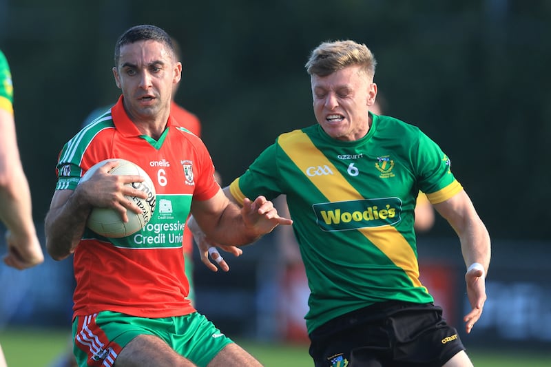 Ballymun Kickhams' James McCarthy and Cian Murphy of Thomas Davis. Photograph: Bryan Keane/Inpho