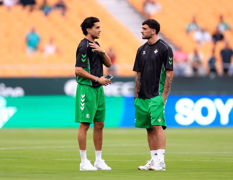 Marc Bartra and Troy Parrott ahead of the game. Photograph: Fran Santiago/Getty Images