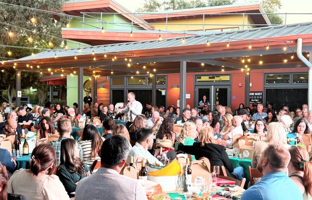 Auctioneer Mark Alman walks through the audience during Hooray for Happy Hollow, a fundraiser to support Happy Hollow Park & Zoo on Saturday, Sept. 12, 2026. (Sal Pizarro/Bay Area News Group)