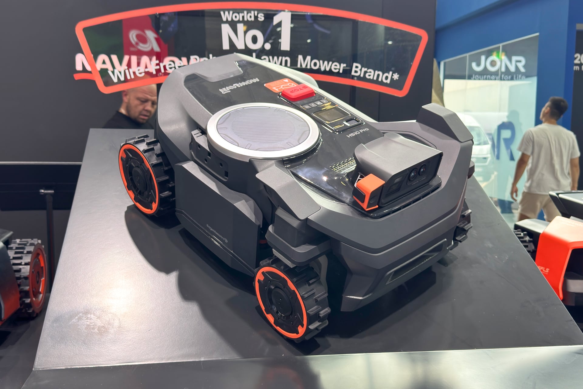 Segway Navimow H5 Pro pictured from a high front angle, sitting on a pedestal 