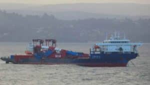 Shore cranes lashed to the deck of a heavy lift ship