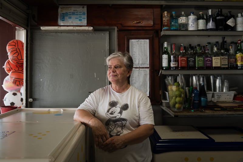 Emilia Pisciotti at her beachside bar in Agrigento, Italy. Photograph: Gianni Cipriano/The New York Times
                      