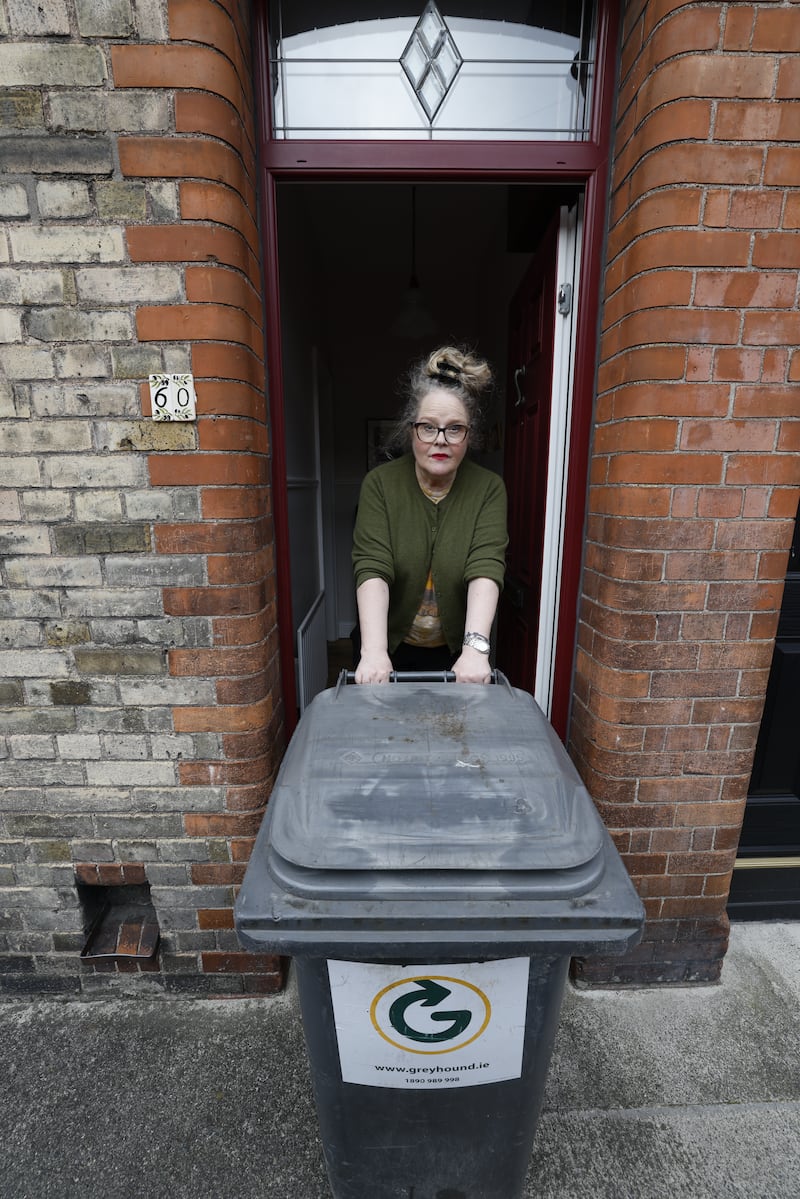 Christine Lucignano with a wheelie bin in Stoneybatter. Photograph: Nick Bradshaw/The Irish Times