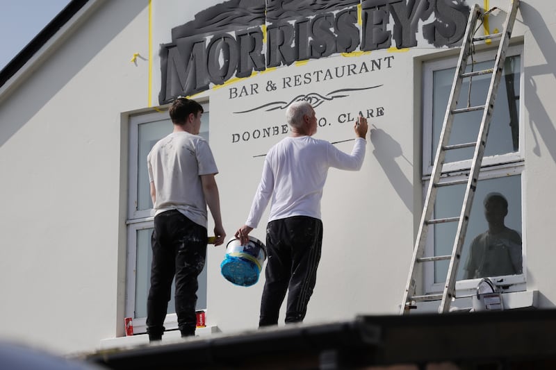 Last minute painting on Morrisseys pub Doonbeg.Photo: Bryan O’Brien / The Irish Times 