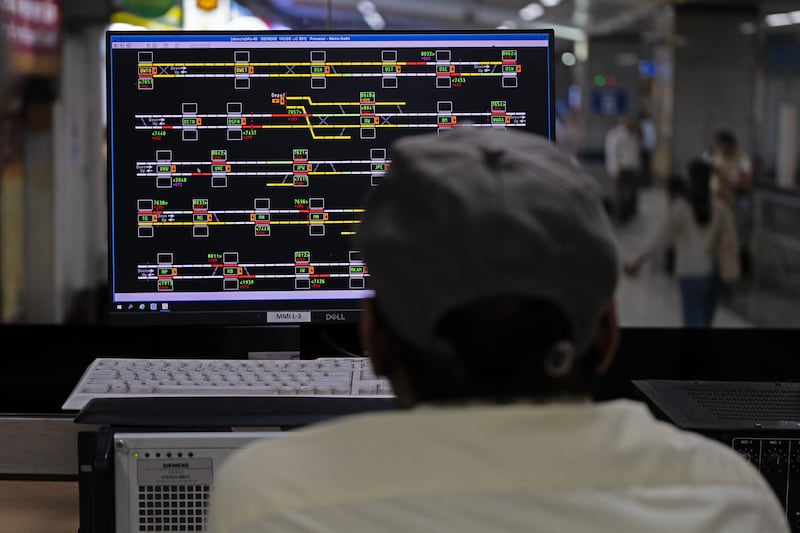 An engineer monitors data for the metro system in New Delhi. Photograph: Karan Deep Singh/The New York Times
                      