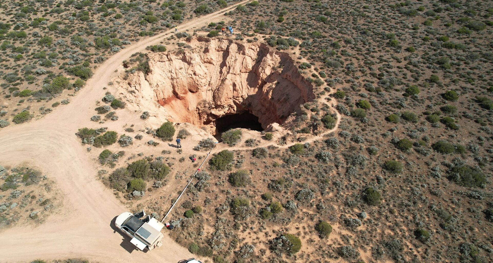 Giant caves beneath sinkhole reveal origin of mystery trenches that score Australia's Nullarbor Plain